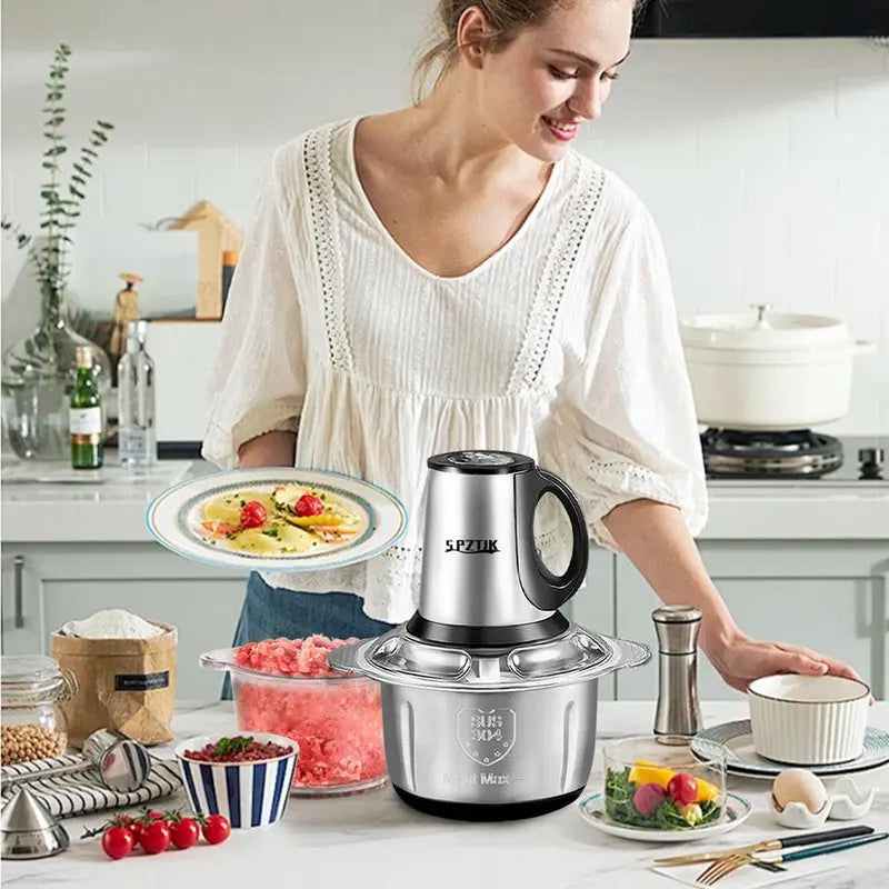 “SPZTJK Multi-Functional Electric Chopper features a dual-bowl design, handling meat and vegetables with ease. Sharp blades and high-speed chopping make meal prep fast and effortless.”